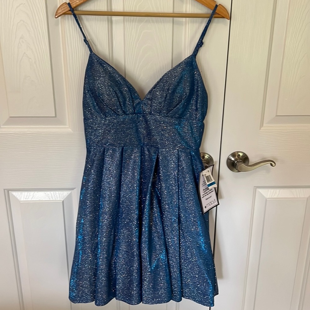 Cocktail, wedding, or any special occasion mini dress. Blue sparkle size 9/10.